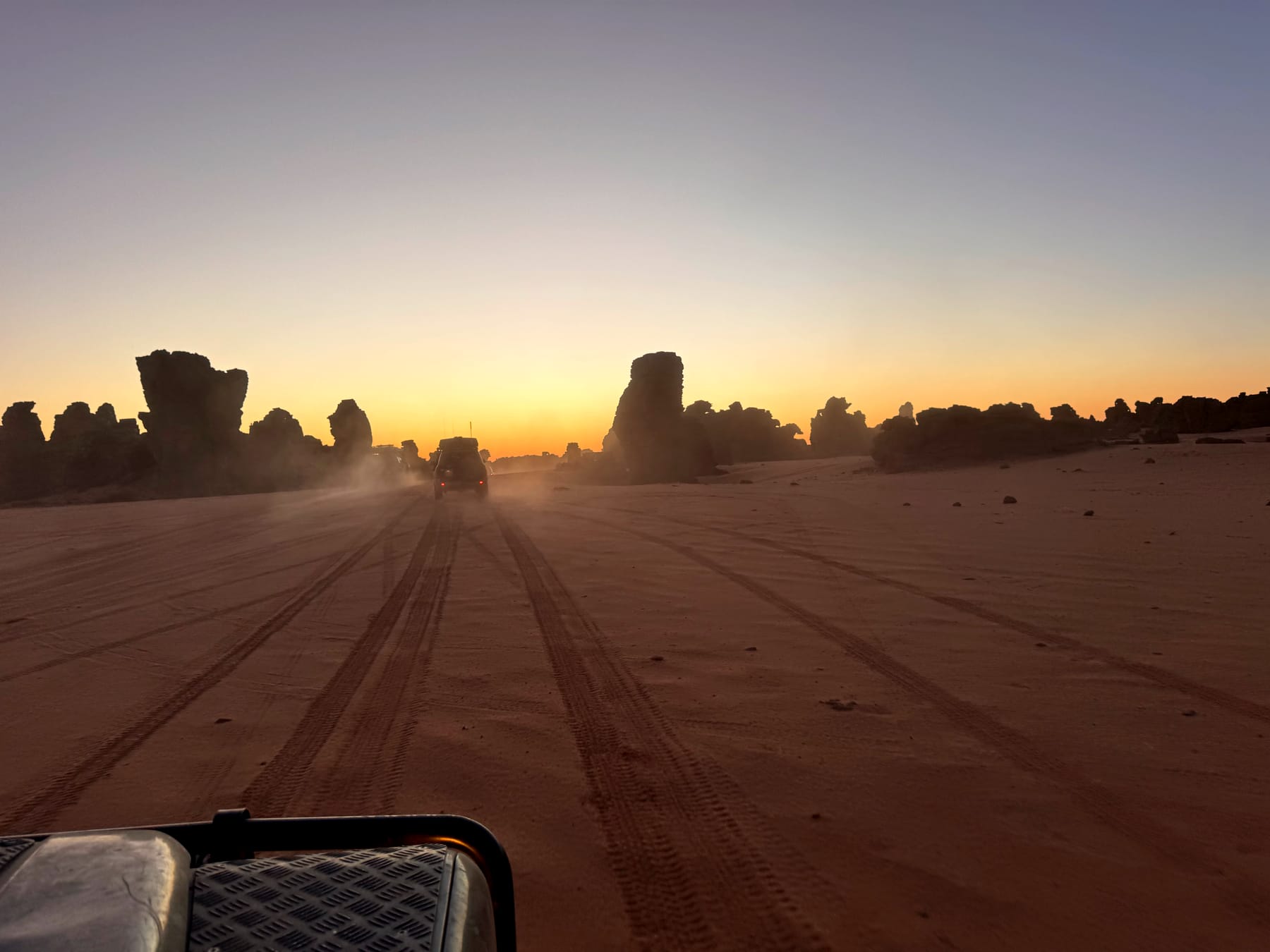 Convoy, dust, sunset.