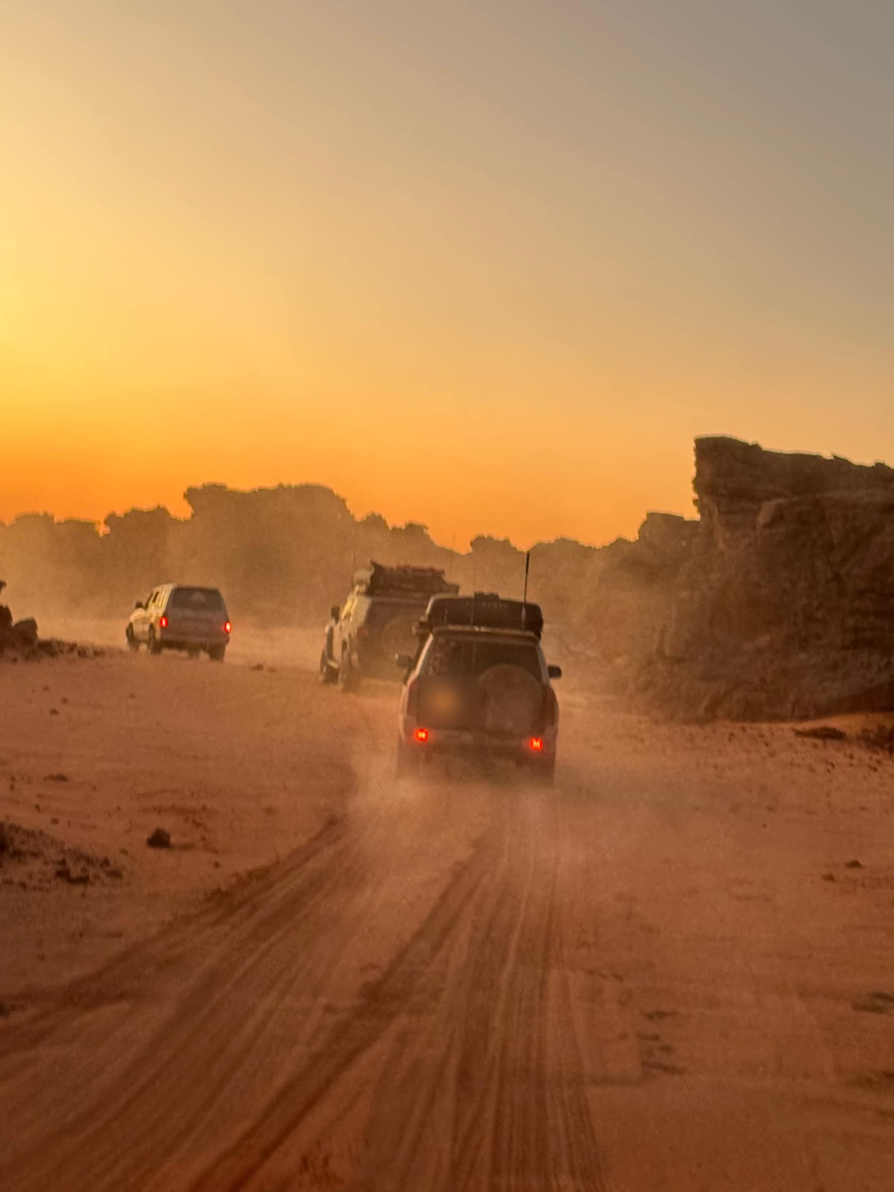 Convoy, dust, sunset.